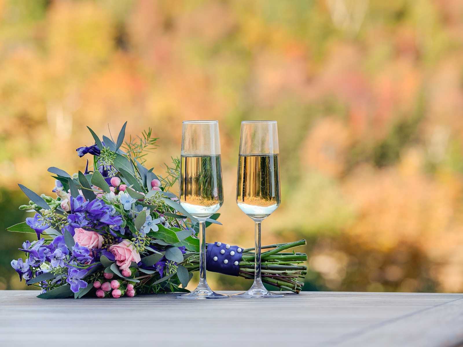Champagne Flutes with Wedding Bouquet and Mt. Washington in the Background