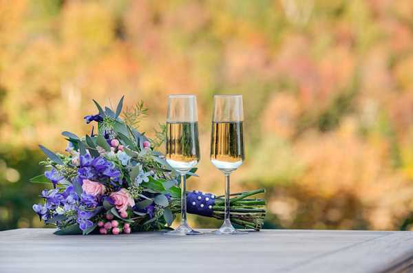 Champagne Flutes with Wedding Bouquet and Mt. Washington in the Background